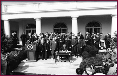 President Johnson signing the EOA, August 1964